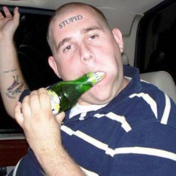Is That a Product Label on His Head?-15 People With Terrible Face Tattoos