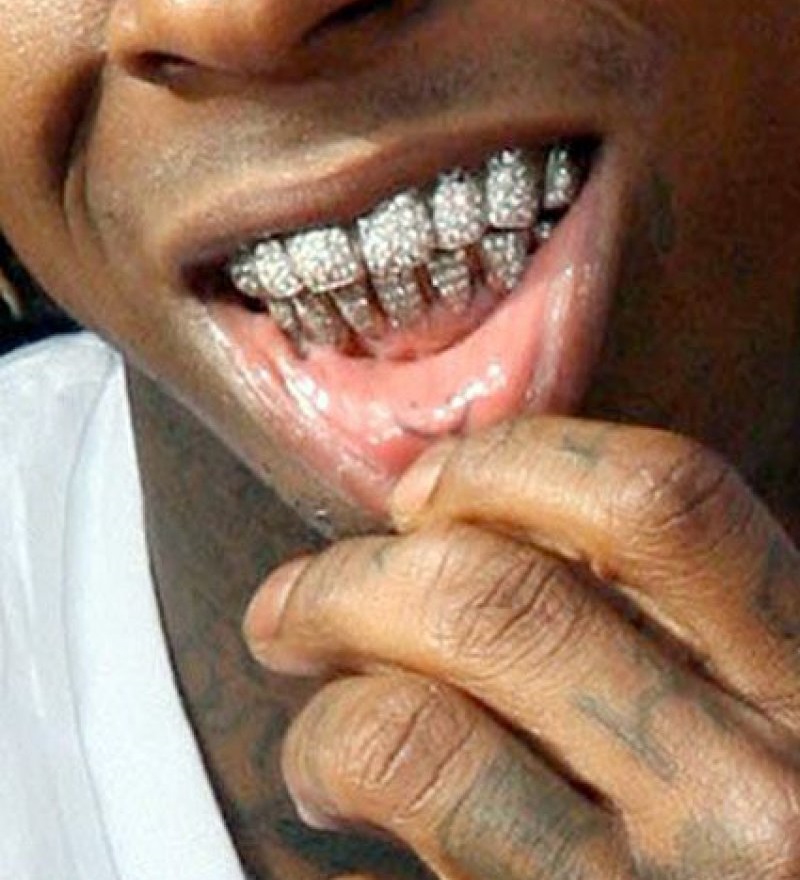 Smiley Face On His Lower Lip-15 Bizarre Lil Wayne's Tattoos And Their Meanings
