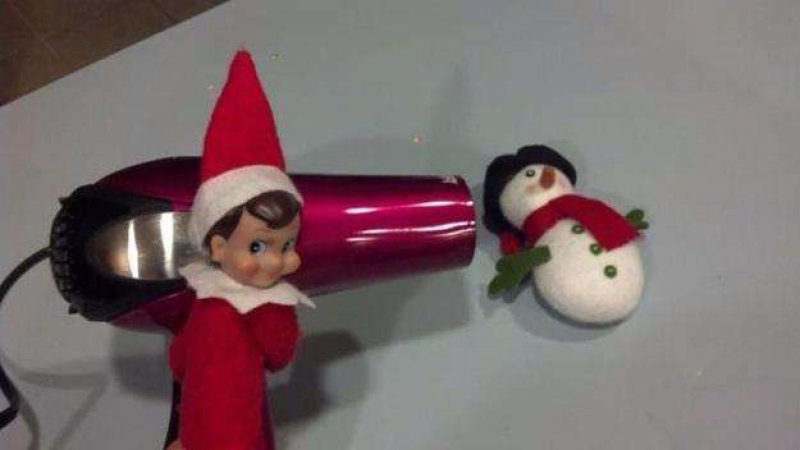 Blowing Snowman Away-15 Hilarious Photos Of The Elf On The Shelf Gone Wrong