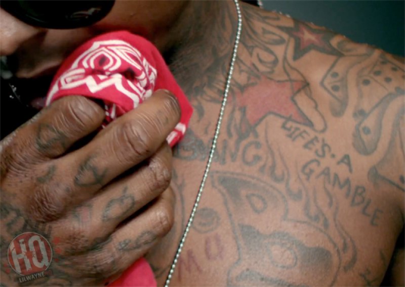Life's A Gamble On His Left Shoulder-15 Bizarre Lil Wayne's Tattoos And Their Meanings