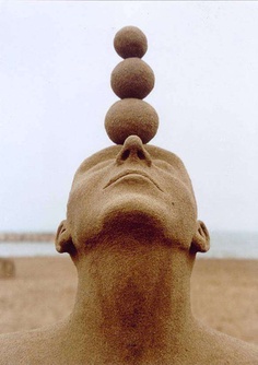 The balancing act sand sculpture-15 Most Bizarre Sand Art Sculptures Ever Created