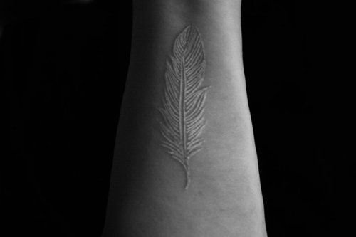 Feather-tattoo-design-15 Amazing White Ink Tattoos That You Need To Check Right Now